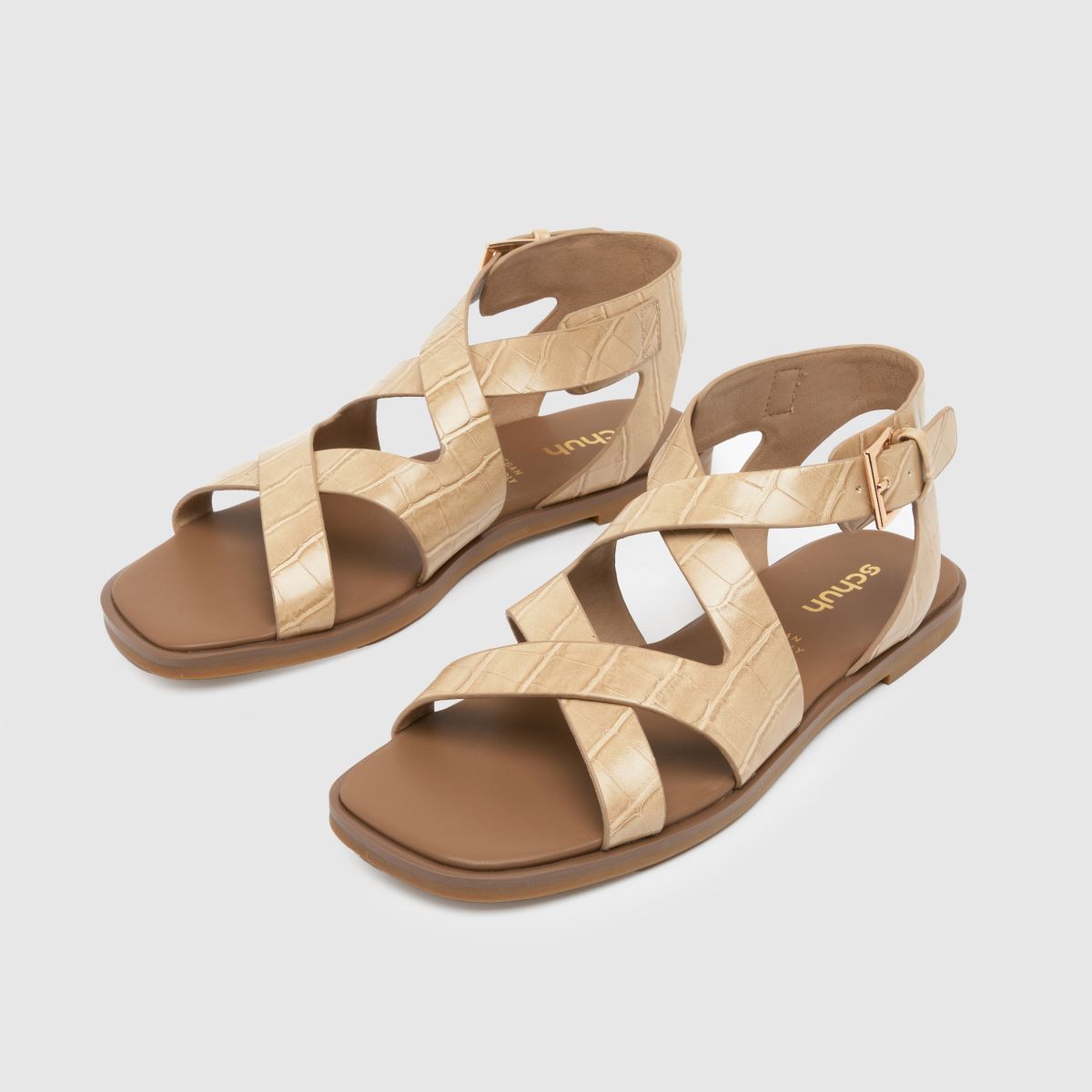 Schuh Tide – Naturfärgade platta sandaler med krokodilmönster