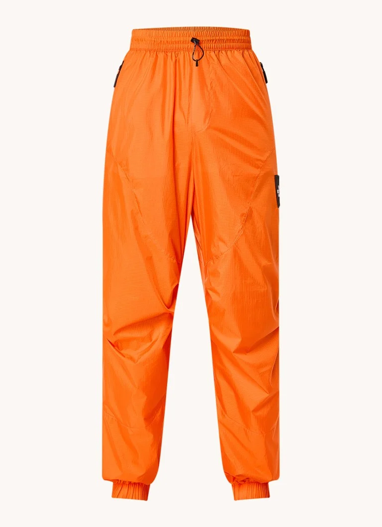 The North Face TNF x Yinka Ilori sašaurinātas bikses ar rāvējslēdzēja kabatām un logotipu