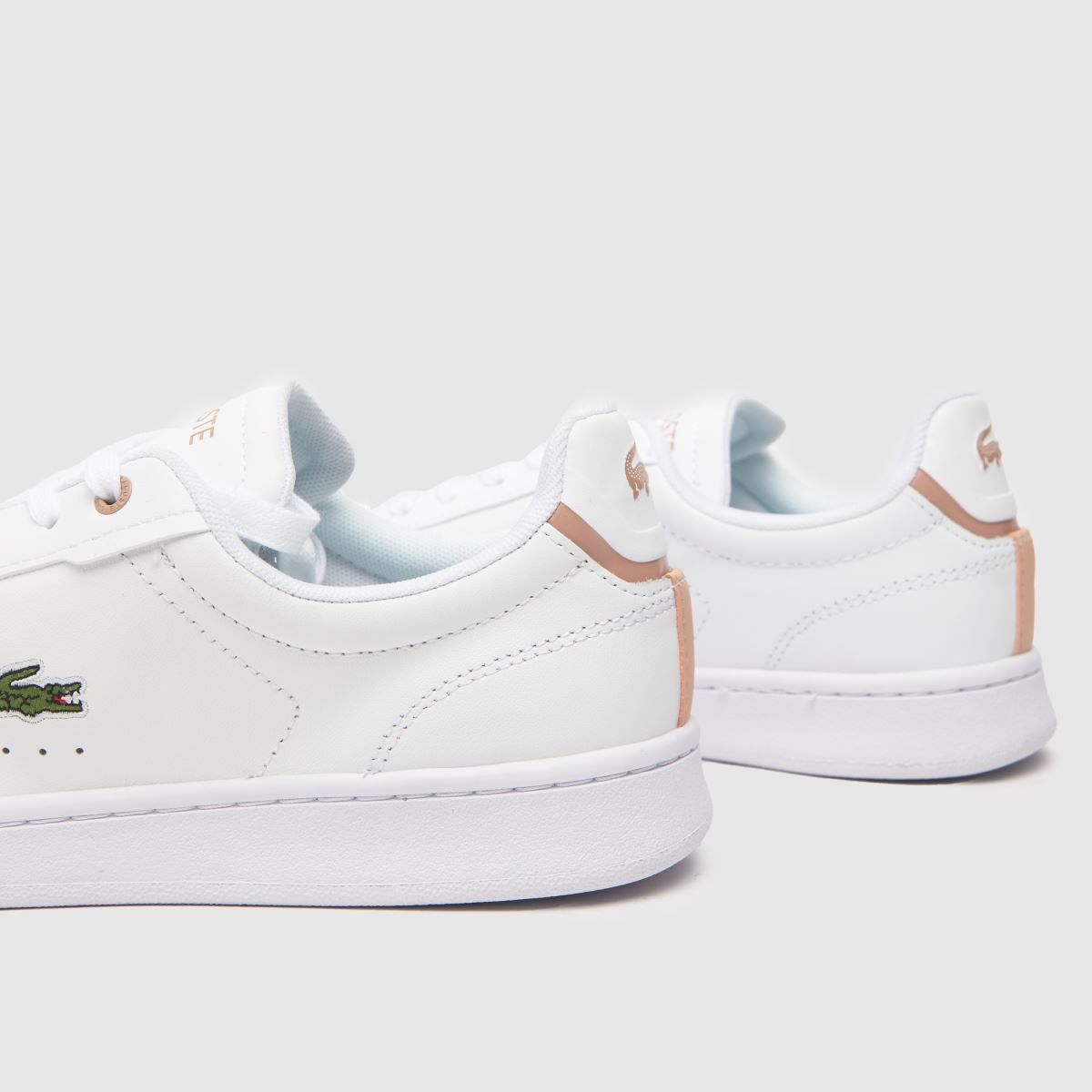 Lacoste Carnaby Pro-sneakers i vitt och rosa