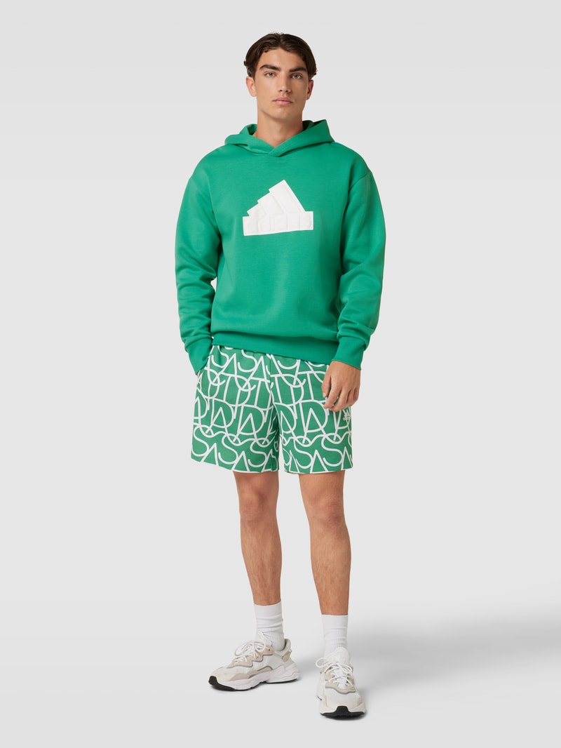 Sweatshorts mit Allover-Logo in hellgrün