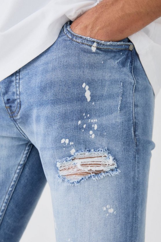 Zerrissene Skinny Stretch Jeans mit Farbspritzern