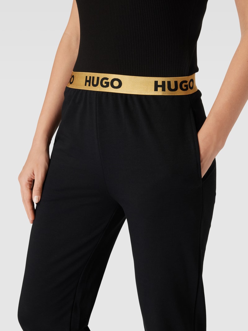 Stoffhose mit elastischem Logo-Bund in gold
