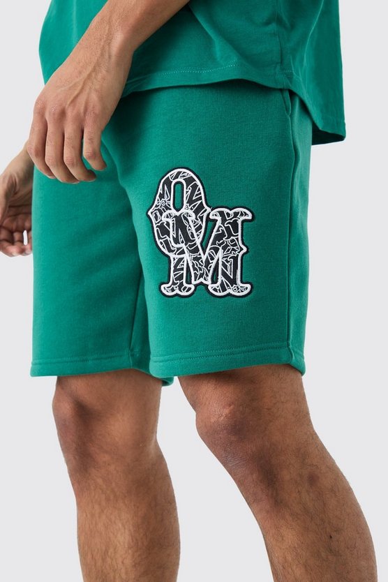 Lockere mittellange Shorts mit Applikation