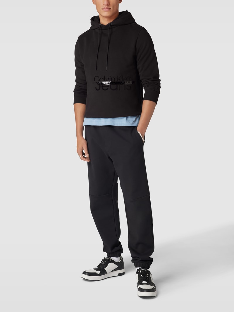 Hoodie mit Label-Print Modell 'DISRUPTED' in schwarz