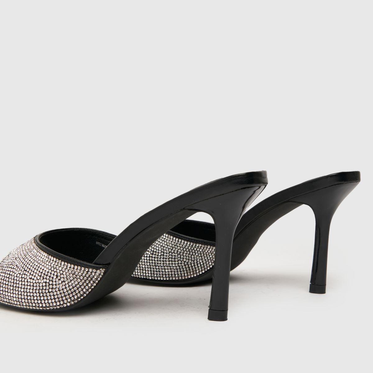 Schuh – Svarta högklackade muleskor med sherryutsmyckning