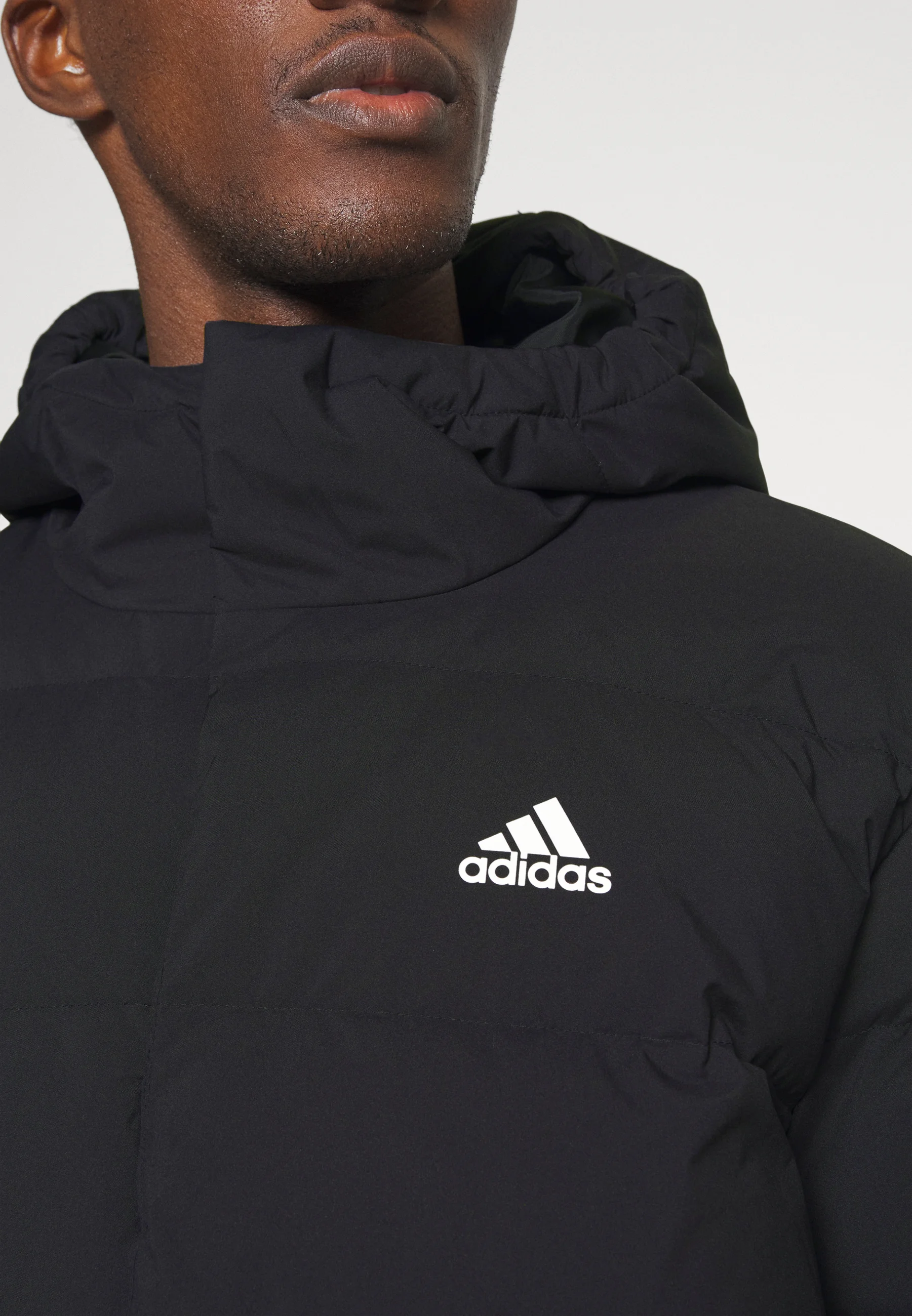 adidas Sportswear HELIONIC HOODED DOWN - Chaqueta de plumas