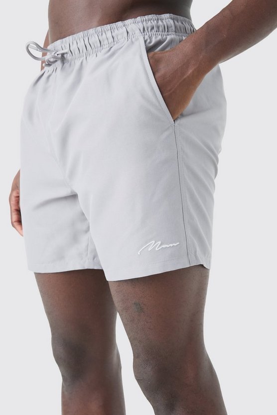 Man Signature mittellange Badehose