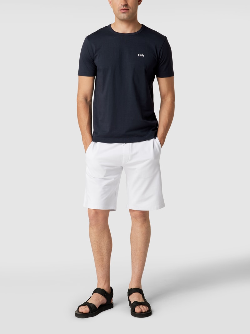 T-Shirt mit Label-Schriftzug Modell 'Tee Curved' in dunkelblau