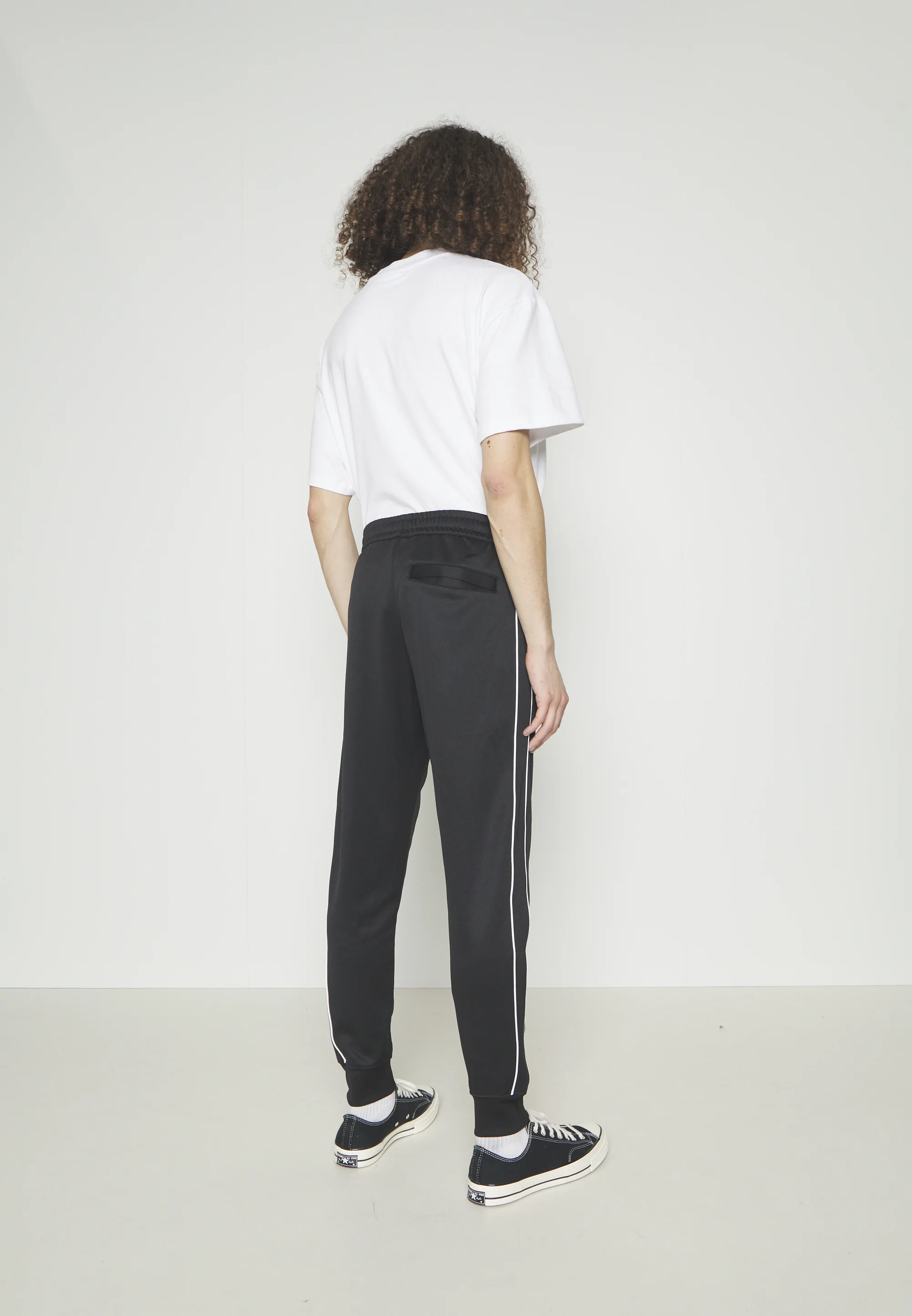 Nike Sportswear CLUB PANT - Pantalones deportivos