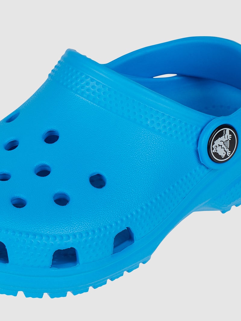 Clogs mit Fesselriemen in ozean blau