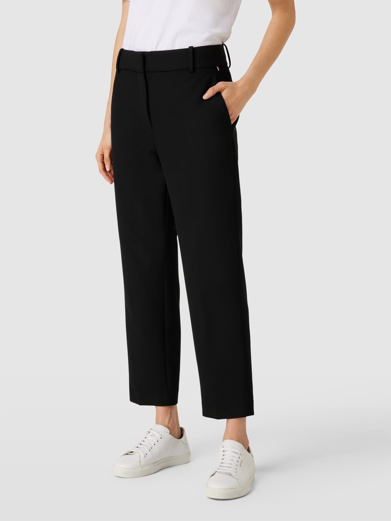 Stoffhose in unifarbenem Design mit Eingrifftaschen in schwarz