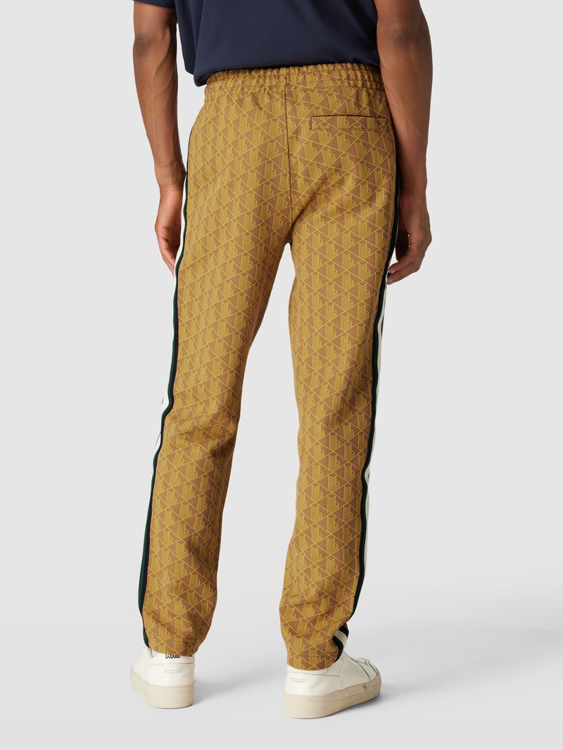 Regular Fit Sweatpants mit Allover-Muster und Galonstreifen in gelb