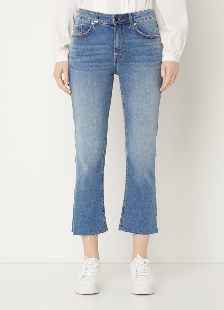 Jeans Benetton a vita media e taglio svasato, lavaggio scuro.