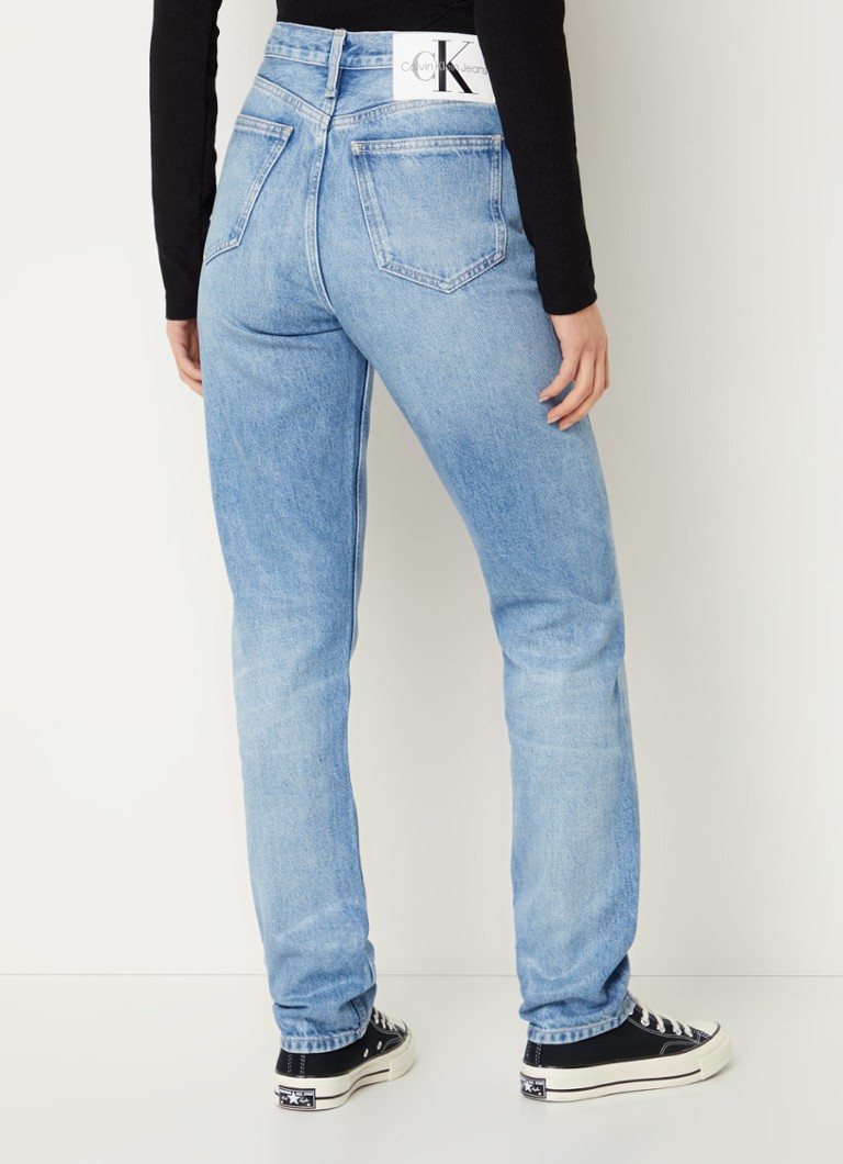 Calvin Klein high-waist slim-fit jeans with a medium wash