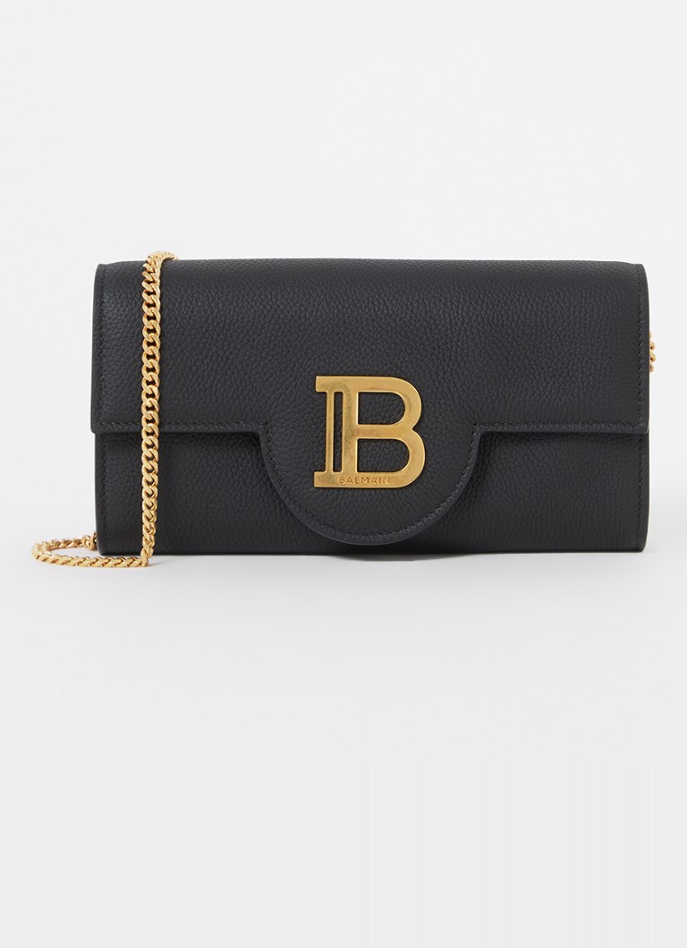 Clutch Balmain B-Buzz em pele de vitelo com alça de ombro removível.