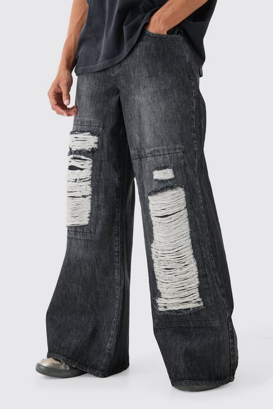 Lockere schwarze Jeans mit extremen Rissen