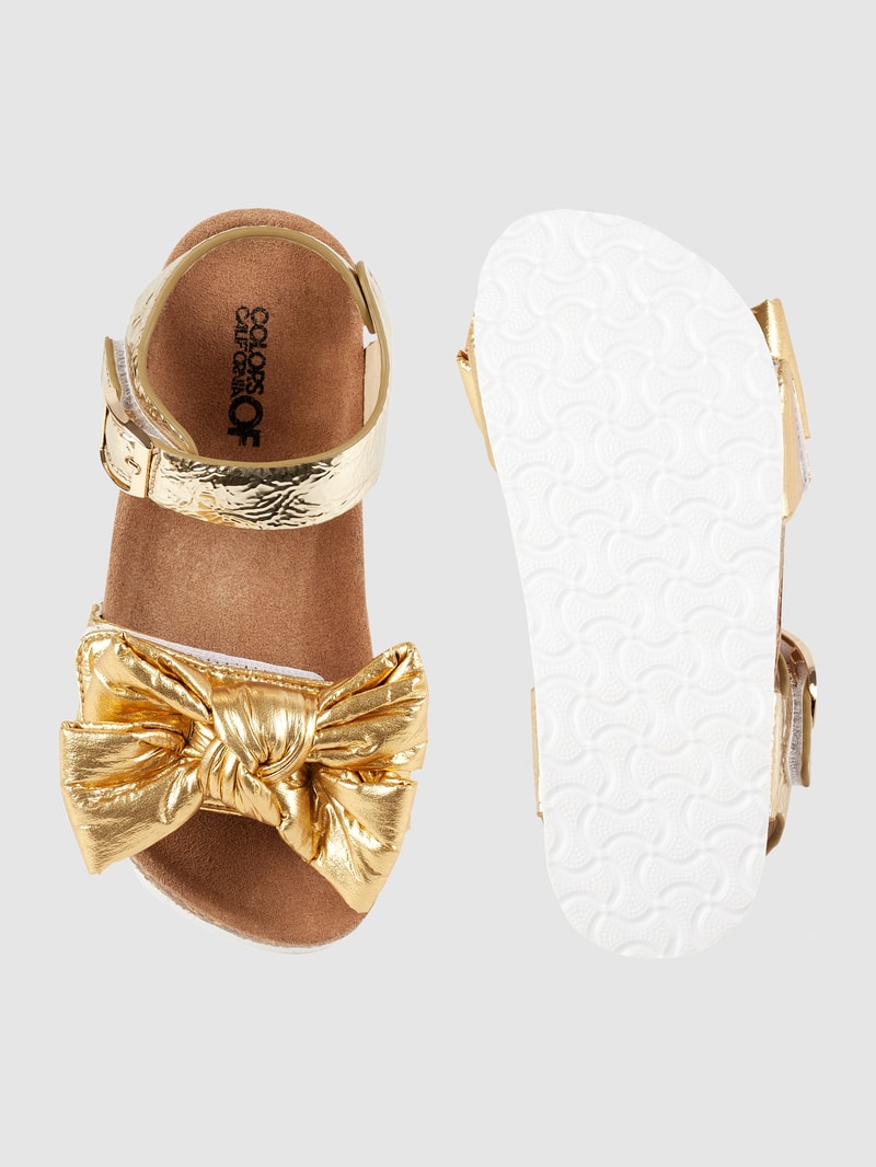Sandalen mit Zierschleife in gold