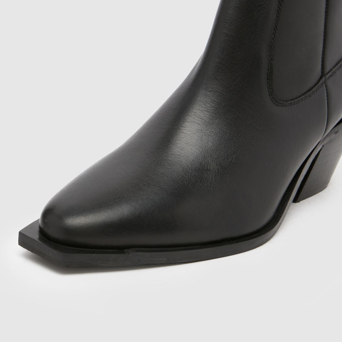 Schuh – Svarta westernstövlar i läder med briar-motiv
