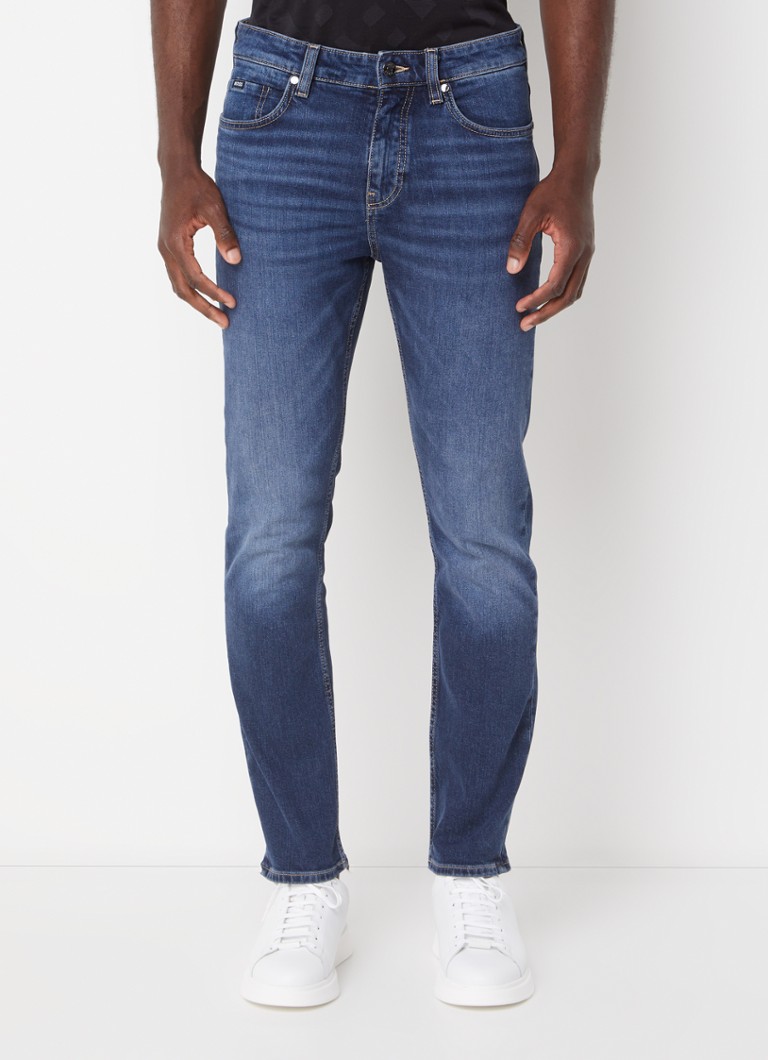 Blugi HUGO BOSS H-Delaware, croială slim, de culoare închisă, cu buzunare laterale.