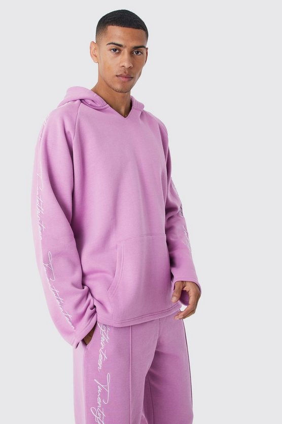 Oversize Trainingsanzug mit rohem Saum und Stickerei