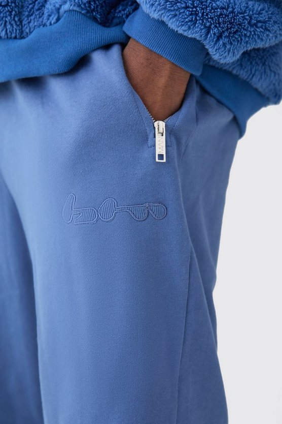 Plus gerippte Oversize Jogginghose mit Applikation und Reißverschluss