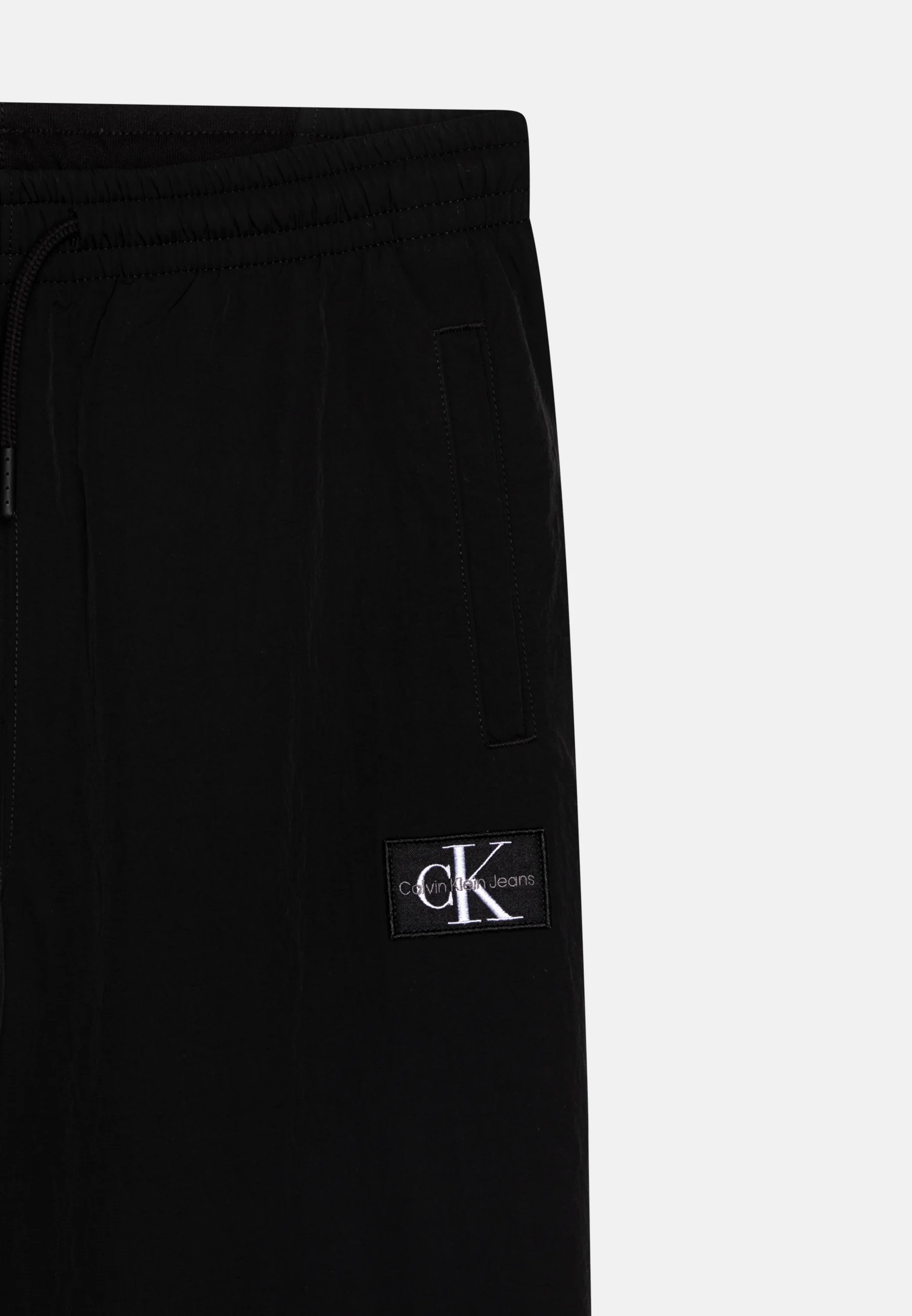 Pantalones deportivos Calvin Klein Jeans MIX MEDIA MONOCROMÁTICOS