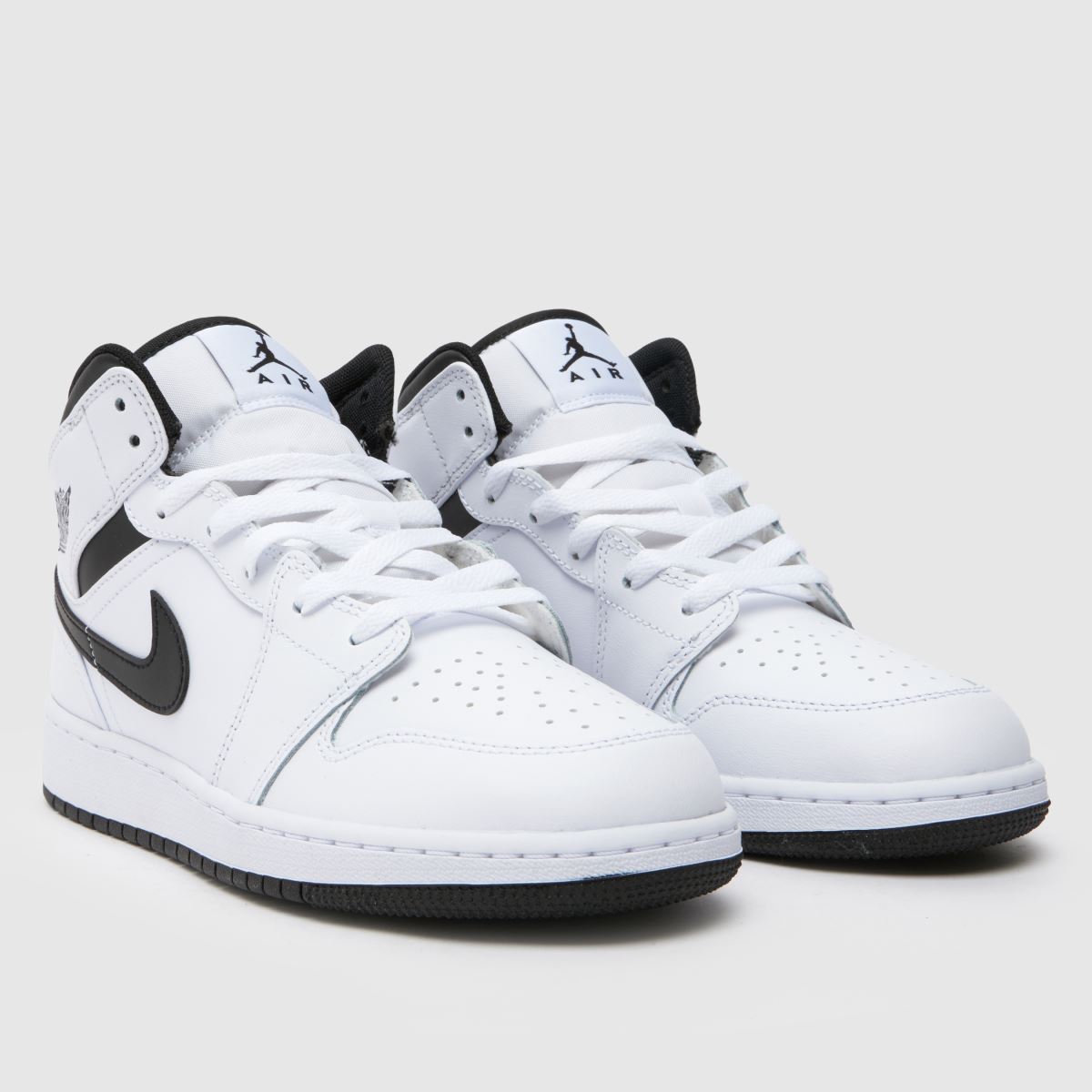 Nike Jordan vita och svarta Air Jordan 1 Mid ungdomsskor