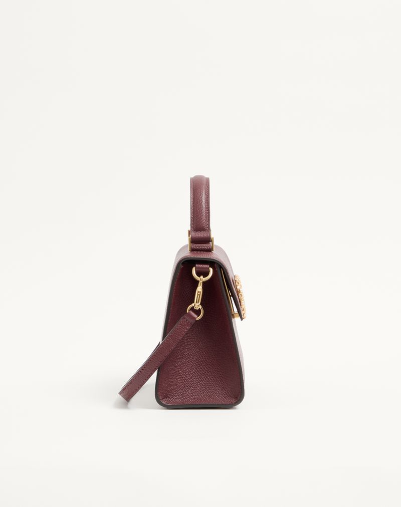 Sac à main Valentino Garavani Vsling petit modèle en cuir de veau grainé avec logo bijou