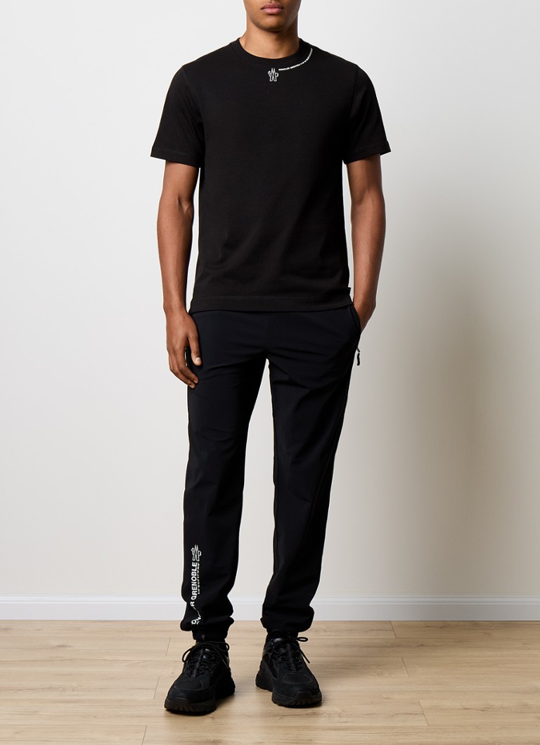 Pantaloni de trening Moncler conici cu buzunare cu fermoar