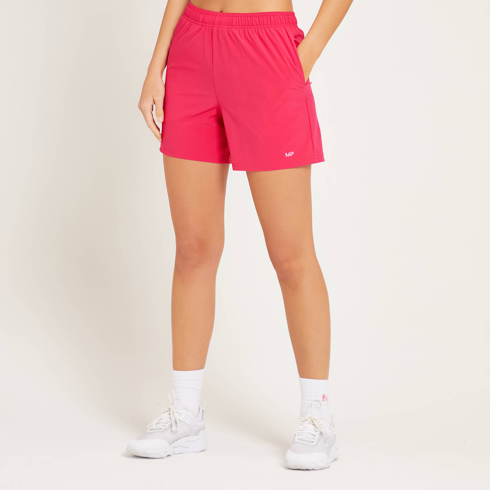 Short d’entraînement en matière tissée MP pour femmes – Magenta