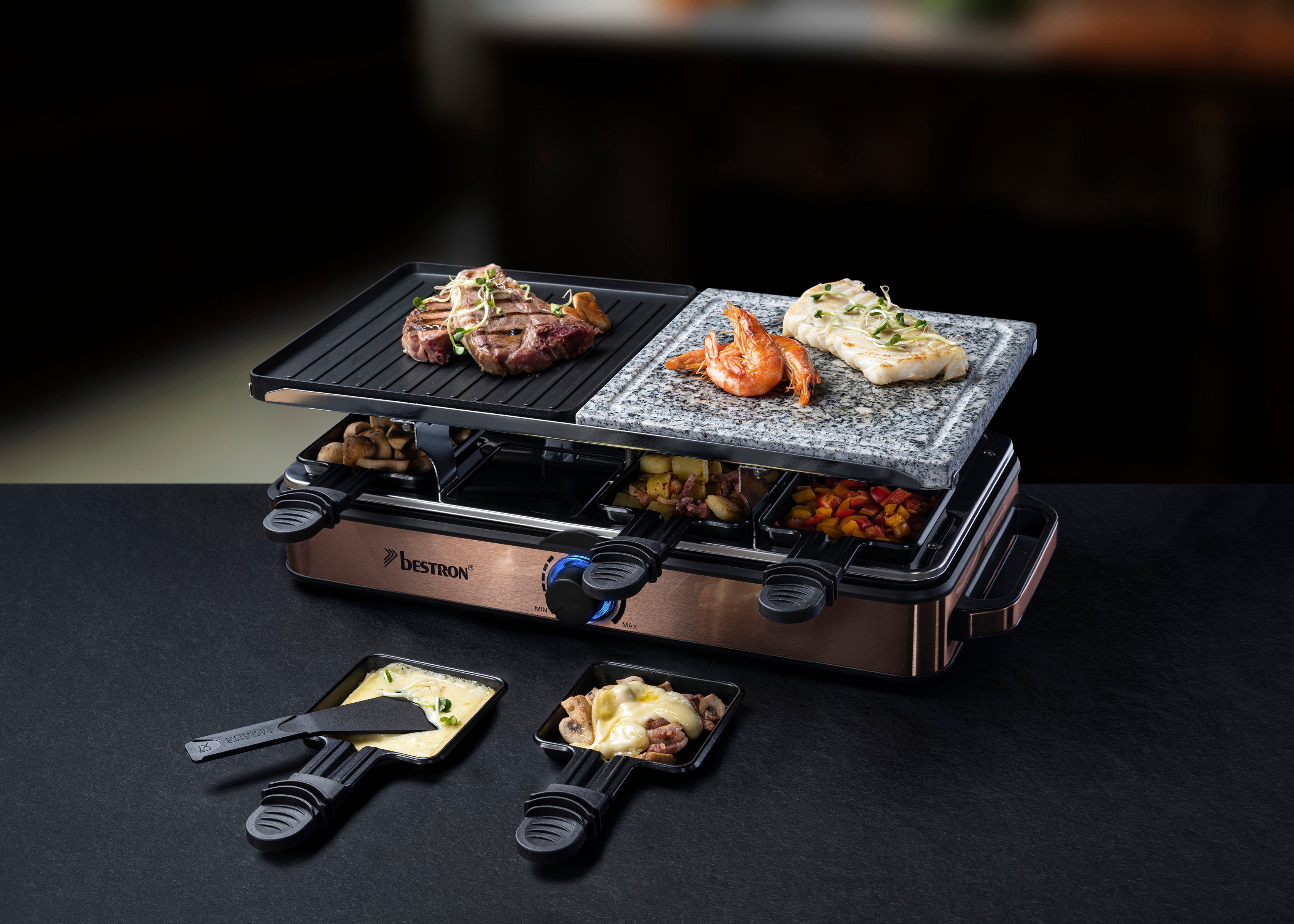 bestron Raclette ARG1200CO, 8 Raclettepfännchen, 1400 W, Naturstein & antihaftbeschichtete Grillplatte, 8 Pfännchen & 8 Schaber