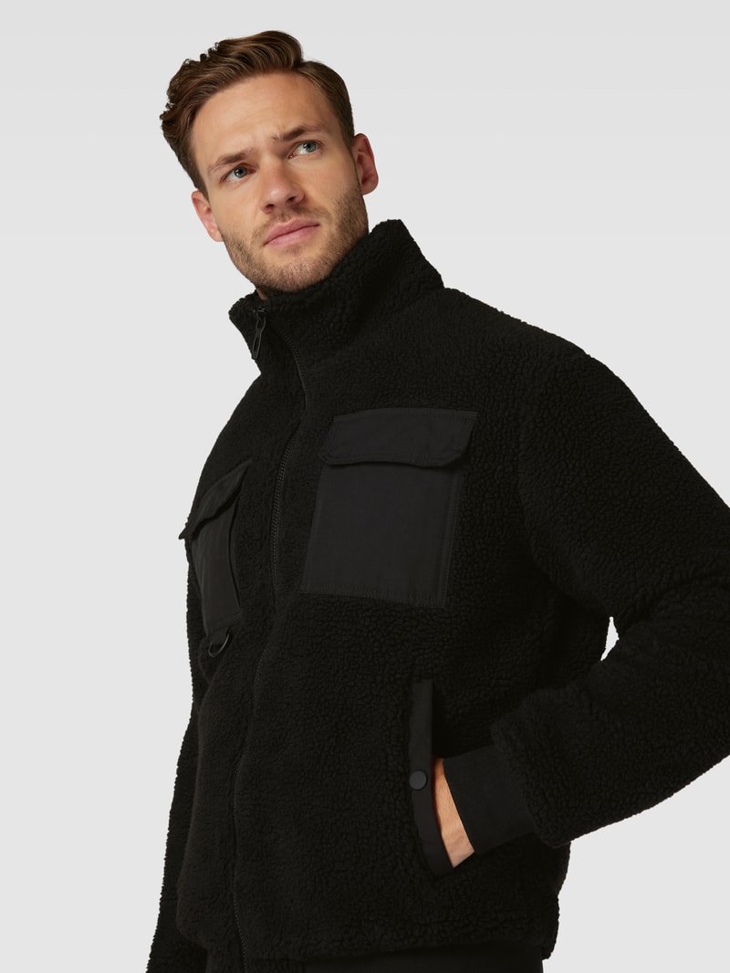 Jacke mit Stehkragen und Brusttaschen in schwarz