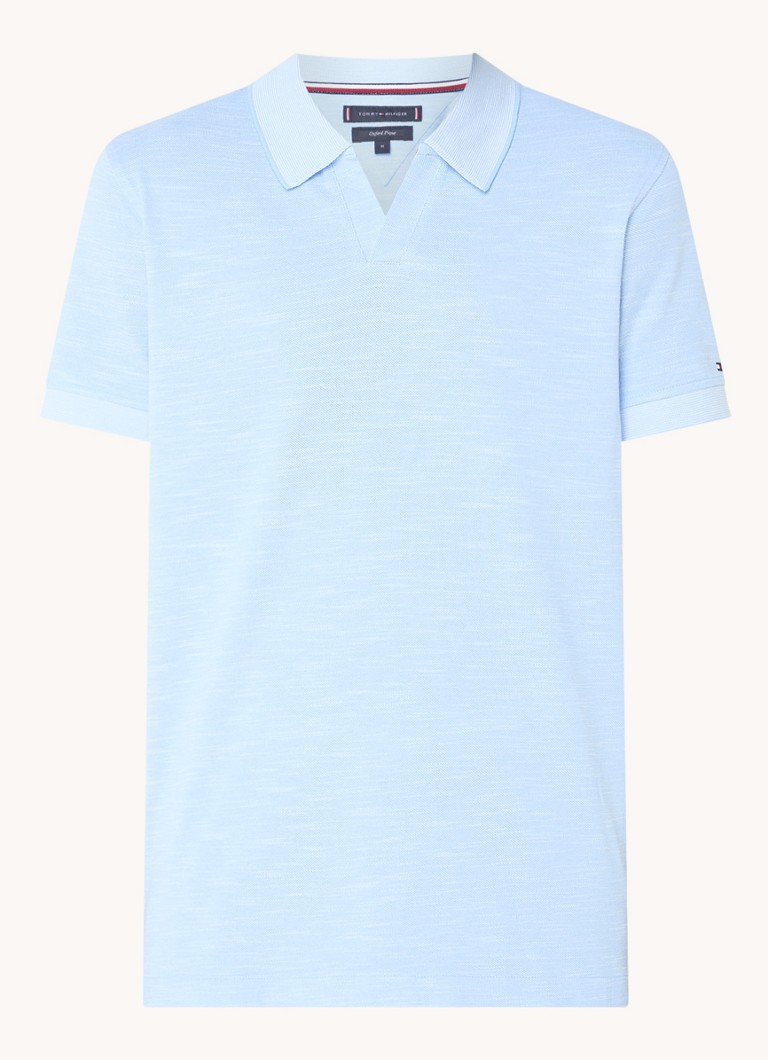 Polo Tommy Hilfiger Mouline de corte regular, confeccionada em algodão piqué.