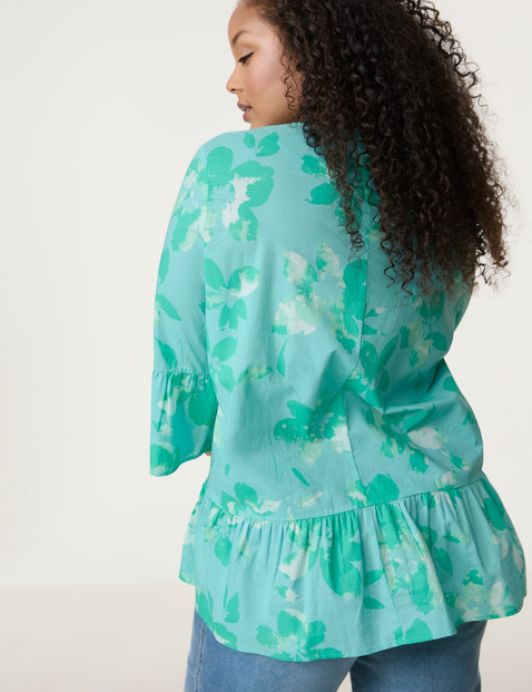 Ausgestellte Bluse mit Volants