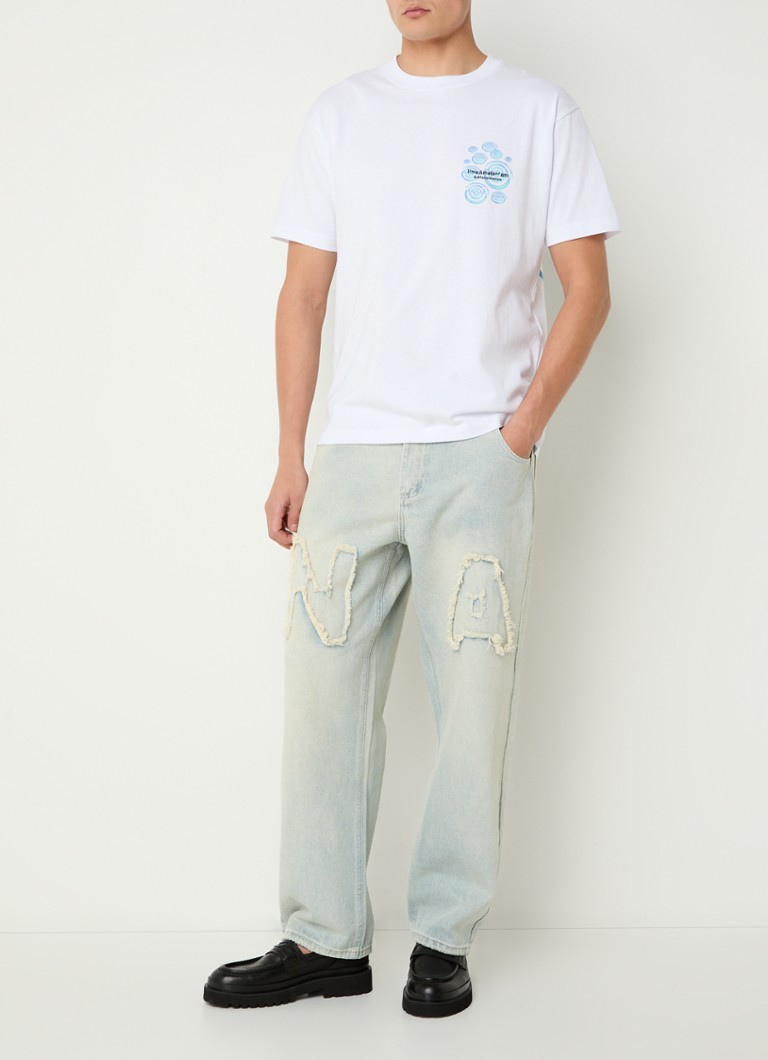 New Amsterdam Surf Associationin Ripple-t-paita, jossa logo ja painatus takana