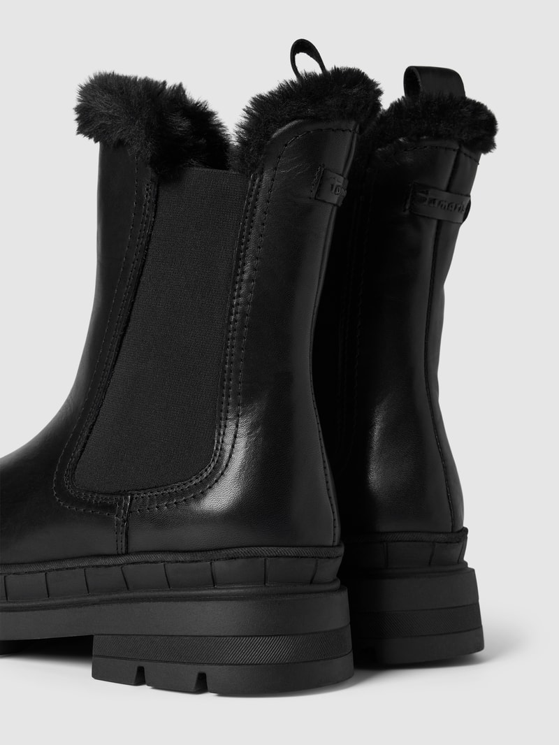 Chelsea Boots aus Leder mit Kunstfellbesatz in schwarz