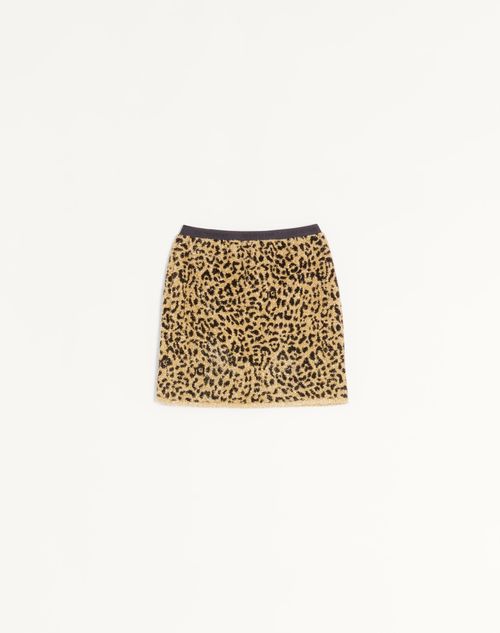 Saia curta em malha jacquard lurex com estampa animal.