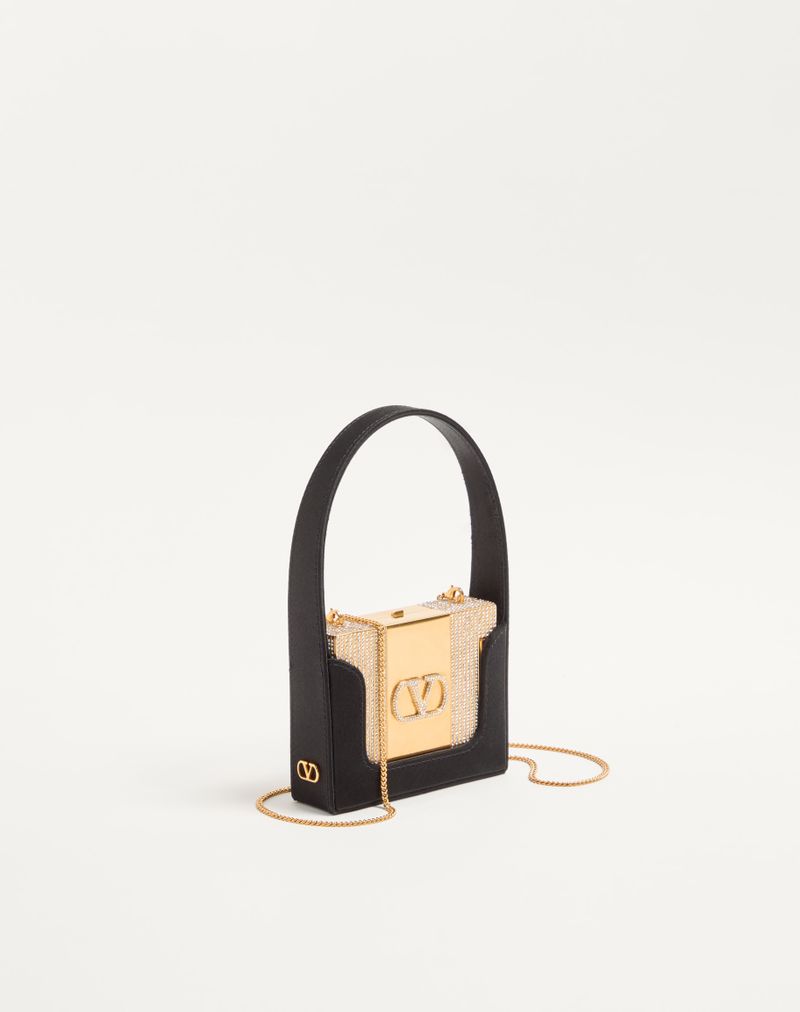 Bolsa Valentino Garavani Minaumorphe em metal com cristais Swarovski® e estojo de cetim.