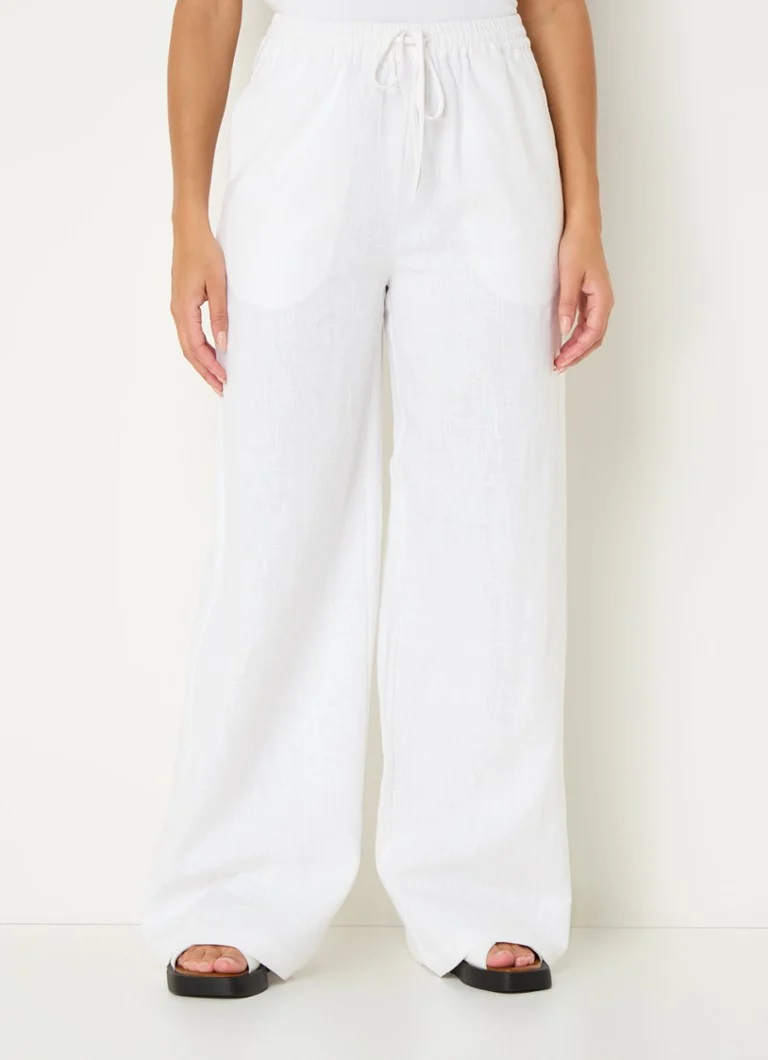 Pantaloni palazzo a vita alta e gamba larga modello Loise di Co'Couture, in lino