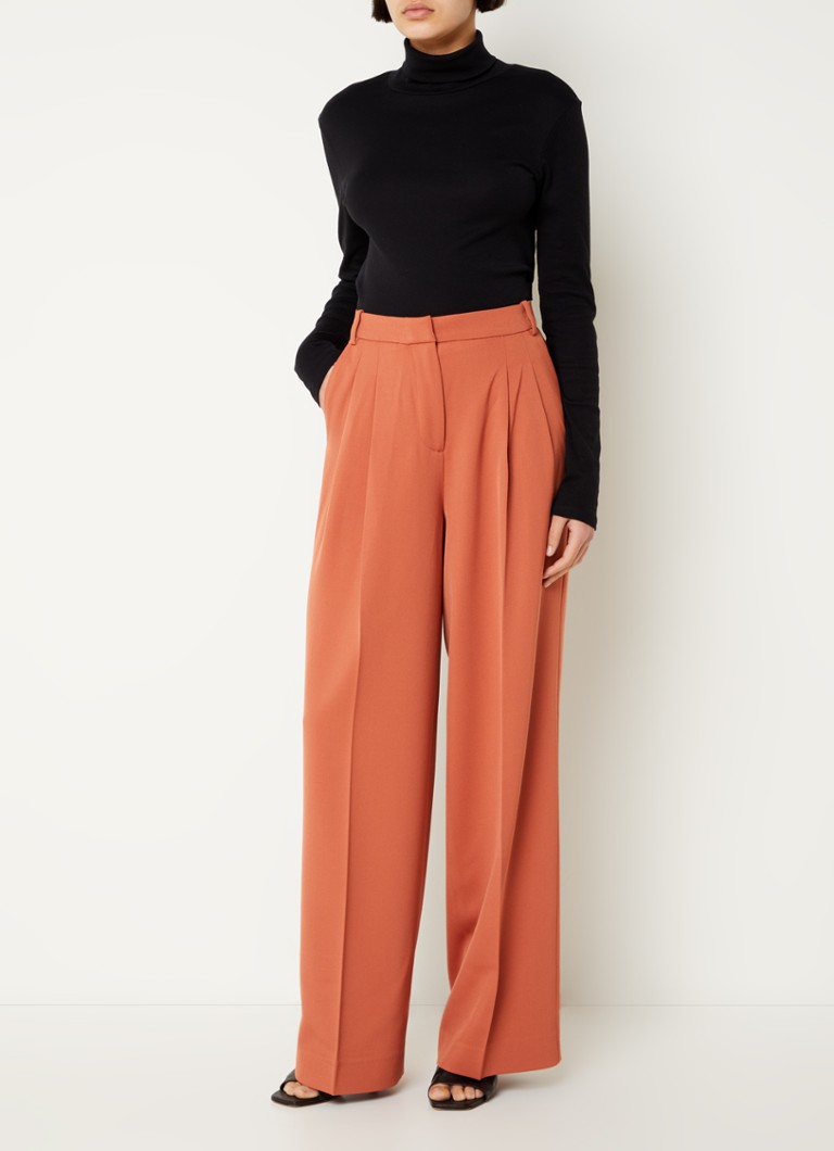 Pantaloni a vita alta e gamba larga di Calvin Klein in misto lana.