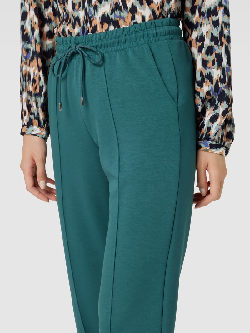 Stoffhose mit Ziernähten in petrol