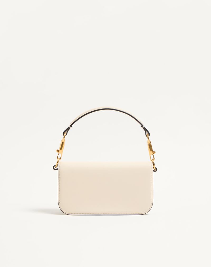 Bolsa de ombro pequena Valentino Garavani Locò em couro de bezerro com logotipo de joia.