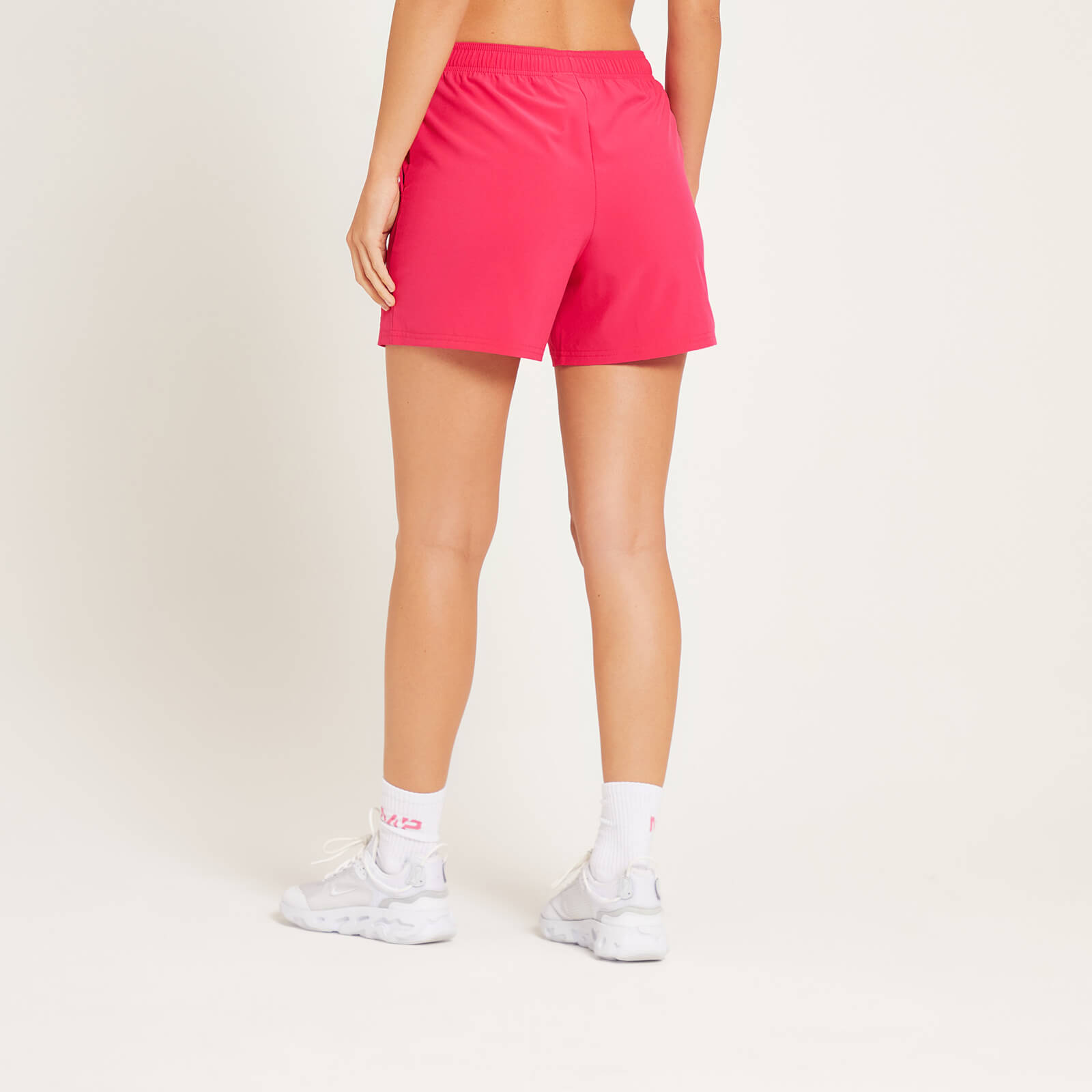 Short d’entraînement en matière tissée MP pour femmes – Magenta