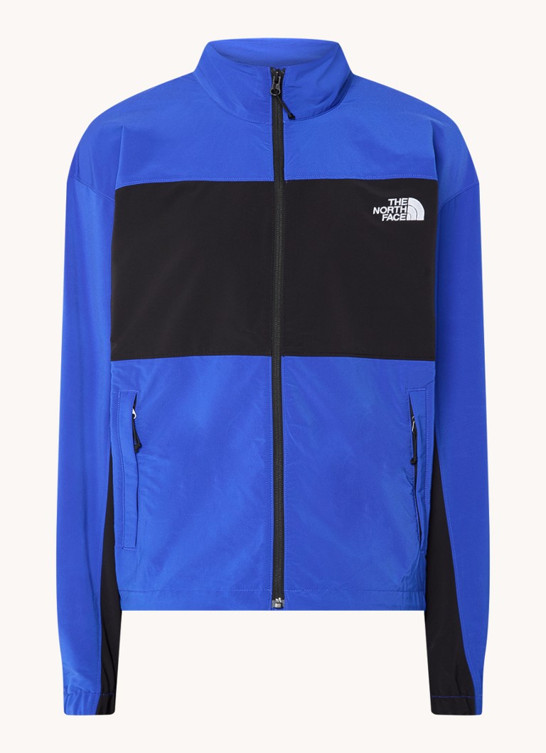 Vjetrovka The North Face s logotipom i džepovima s patentnim zatvaračem