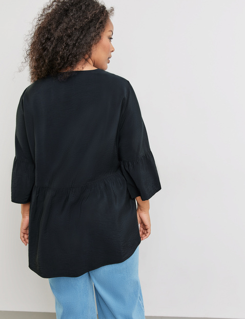 Ausgestellte Bluse mit Volants