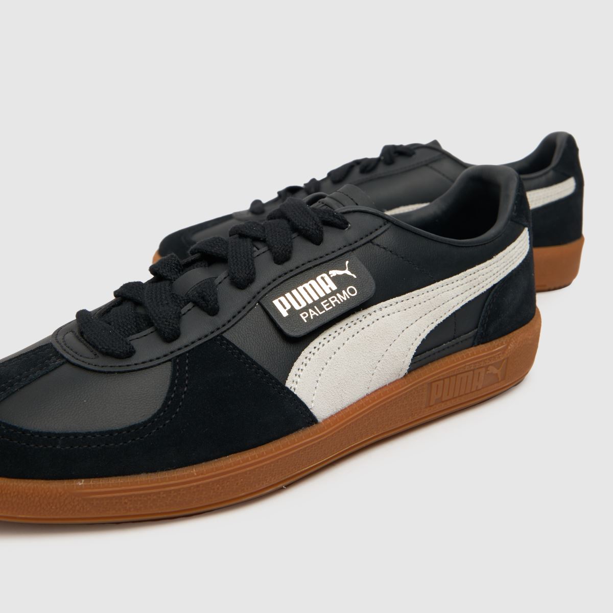 PUMA Palermo lädersneakers i svart och vitt