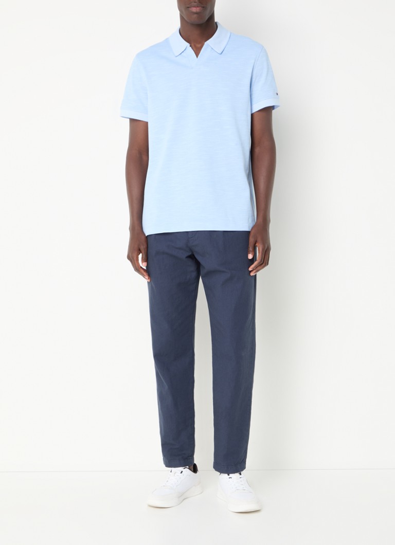 Polo Tommy Hilfiger Mouline de corte regular, confeccionada em algodão piqué.