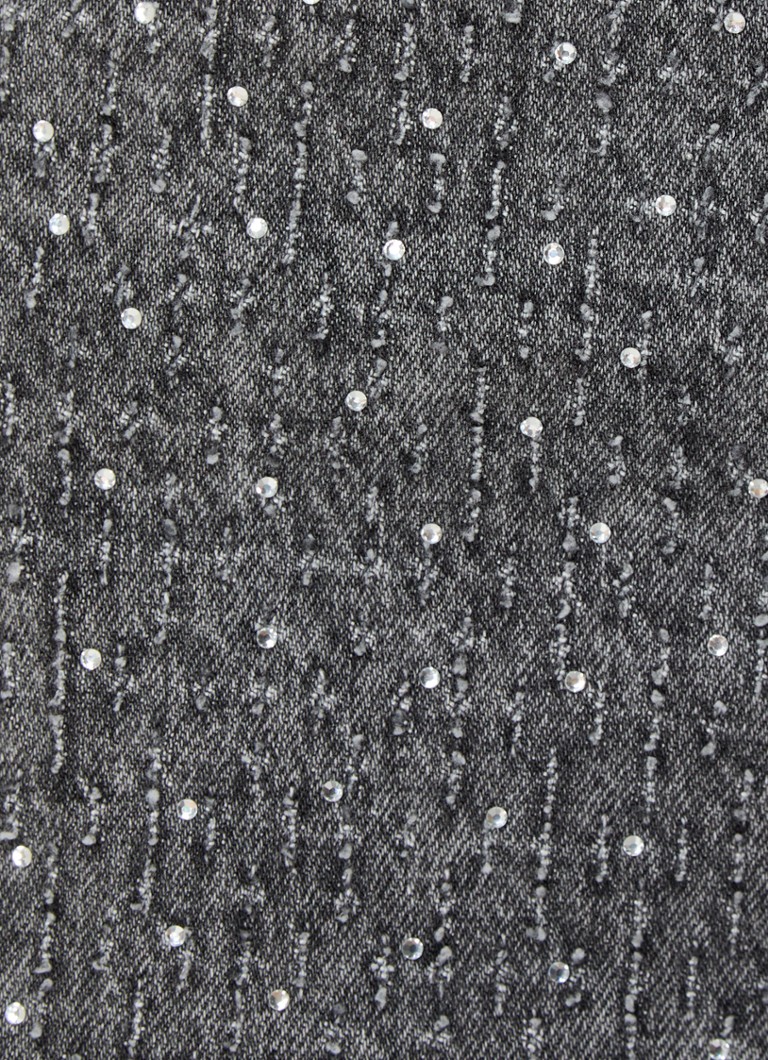 Spodnie kowbojskie, wysokie i półdługie, wykonane z materiału Maje, zdobione kamieniami.