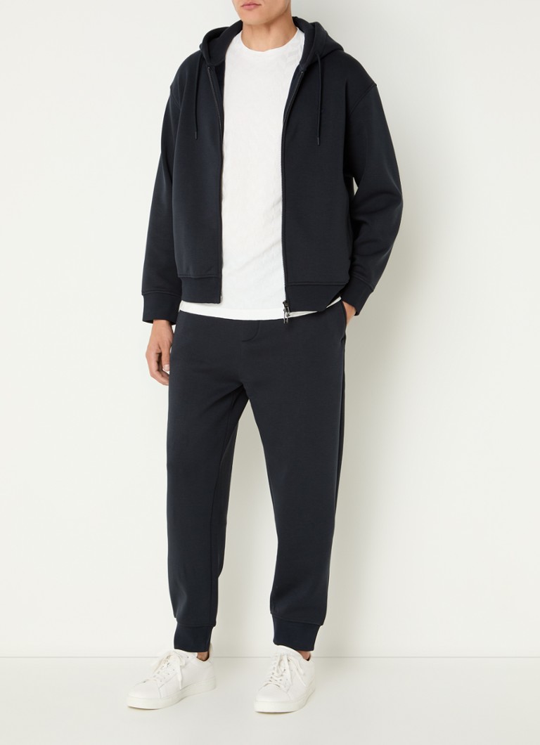 Pantaloni de trening slim fit de la Emporio Armani, confecționați din amestec de lyocell, cu buzunare laterale.