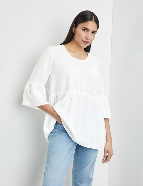 Ausgestellte Bluse mit Volants